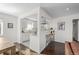 Updated kitchen boasts granite counters, stainless steel appliances, and white cabinets at 2885 Hudson St, Denver, CO 80207