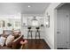 Open kitchen with breakfast bar, modern cabinetry, and a view to the living room at 2885 Hudson St, Denver, CO 80207