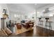 Modern living room with a fireplace, hardwood floors, and open concept design at 2885 Hudson St, Denver, CO 80207