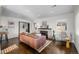 Open concept living room with fireplace, hardwood floors, and natural light at 2885 Hudson St, Denver, CO 80207