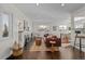 Living room features hardwood floors, fireplace and open concept to kitchen at 2885 Hudson St, Denver, CO 80207