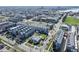 This aerial view displays the property's location to the nearby lake and a city in the distance at 1745 Irving St, Denver, CO 80204