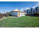 A spacious backyard with lush green grass, a classic wooden fence, and space to play at 1745 Irving St, Denver, CO 80204