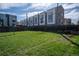 Large, open backyard features green grass surrounded by a classic wooden fence at 1745 Irving St, Denver, CO 80204