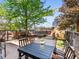 Beautiful backyard with a patio, seating area, and a mature tree for shade and privacy at 3133 Blake St # 3, Denver, CO 80205