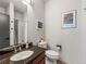 Well-lit bathroom featuring a granite countertop vanity and shower with neutral colors at 3133 Blake St # 3, Denver, CO 80205