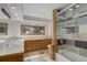 Modern bathroom featuring a spacious shower, double sinks, vanity with storage and natural light at 96 Carolyn Rd, Evergreen, CO 80439