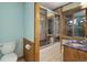 Bathroom featuring tile shower, vanity sink with wood accents, and a toilet at 96 Carolyn Rd, Evergreen, CO 80439