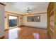 Large bonus room with wood floors, built-in shelving, and big windows showcasing natural scenery at 96 Carolyn Rd, Evergreen, CO 80439