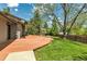 Backyard features a lush lawn, mature trees and a large wooden deck at 1250 Acropolis Dr, Lafayette, CO 80026