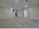 Finished basement with neutral carpet, recessed lighting, and open doorway at 1250 Acropolis Dr, Lafayette, CO 80026