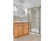 Bright bathroom featuring a glass enclosed shower, vanity and modern lighting at 1250 Acropolis Dr, Lafayette, CO 80026
