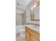 Well-lit bathroom featuring a tub and shower combination, vanity and neutral tile at 1250 Acropolis Dr, Lafayette, CO 80026
