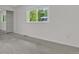 Bright bedroom features a large window for natural light and a closet with shelving at 1250 Acropolis Dr, Lafayette, CO 80026