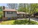 Charming home with brick accents, neutral siding, mature landscaping, and an attached two car garage at 1250 Acropolis Dr, Lafayette, CO 80026