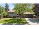 Charming home with brick accents, neutral siding, mature landscaping, and an attached two car garage at 1250 Acropolis Dr, Lafayette, CO 80026