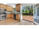 Bright kitchen featuring wood cabinets, stainless steel appliances, and access to the backyard deck at 1250 Acropolis Dr, Lafayette, CO 80026