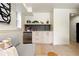 Cozy bar area with mini fridge, shelving, and modern finishes, perfect for entertaining at 1260 N Stuart St # 2, Denver, CO 80204