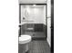 Modern bathroom with black and white tile and a walk-in shower at 1260 N Stuart St # 2, Denver, CO 80204