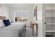 Cozy bedroom featuring a comfortable bed and built-in shelves at 1260 N Stuart St # 2, Denver, CO 80204