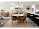 Modern dining area with a round table and leather chairs at 1260 N Stuart St # 2, Denver, CO 80204