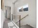 Modern staircase with metal railing and wood accents at 1260 N Stuart St # 2, Denver, CO 80204