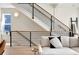 Modern staircase with metal railing and light wood accents at 1260 N Stuart St # 2, Denver, CO 80204