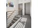 Modern staircase with metal railing and wood accents at 1260 N Stuart St # 2, Denver, CO 80204