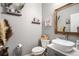 Modern bathroom with a white sink and gray vanity at 7097 S Patsburg Way, Aurora, CO 80016