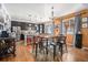 Eat-in kitchen with dark cabinetry, granite counters, and stainless steel appliances at 7097 S Patsburg Way, Aurora, CO 80016