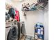 Convenient laundry room with washer, dryer, and storage shelves at 7097 S Patsburg Way, Aurora, CO 80016