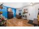 Bright living room with hardwood floors and a home office at 7097 S Patsburg Way, Aurora, CO 80016