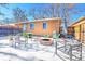 Backyard patio with fire pit, seating, and string lights in winter at 3126 S Franklin St, Englewood, CO 80113