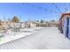 Snowy backyard with a patio, fire pit, and string lights at 3126 S Franklin St, Englewood, CO 80113