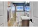 Updated bathroom with a shower/tub combo, tile flooring, and modern vanity at 3126 S Franklin St, Englewood, CO 80113