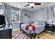 Bright bedroom with a queen bed, ceiling fan and hardwood floors at 3126 S Franklin St, Englewood, CO 80113