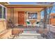 Inviting front porch with seating and brick exterior at 3126 S Franklin St, Englewood, CO 80113