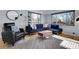 Modern living room with sectional sofa and hardwood floors at 3126 S Franklin St, Englewood, CO 80113
