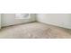 Bright bedroom with neutral carpeting, crisp white walls, and a window offering natural light at 15762 Olmsted Pl, Denver, CO 80239
