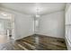 A dining room featuring hardwood floors and neutral paint at 15762 Olmsted Pl, Denver, CO 80239