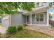 Home featuring fresh, neutral paint, a covered entryway, and green landscaping at 15762 Olmsted Pl, Denver, CO 80239