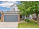 This is a view of the exterior of this two-story home and its attached garage at 15762 Olmsted Pl, Denver, CO 80239