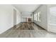Bright living room features neutral paint, hardwood floors, a fireplace, and large windows at 15762 Olmsted Pl, Denver, CO 80239