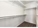 Well-organized walk-in closet with built-in shelving and ample storage space at 15762 Olmsted Pl, Denver, CO 80239