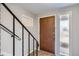 Interior entryway with staircase and frosted glass sidelight at 13440 W 7Th Ave, Lakewood, CO 80401