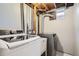 The laundry room features a modern washer and dryer set, as well as plumbing for sink installation at 13440 W 7Th Ave, Lakewood, CO 80401