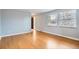 Bright living room with hardwood floors and large windows at 13440 W 7Th Ave, Lakewood, CO 80401