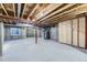 Unfinished basement ready for customization, with exposed beams and concrete flooring at 4689 Tanner Peak Trl, Brighton, CO 80601