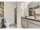 Well-lit bathroom with shower, modern sink, vanity and mirror at 4689 Tanner Peak Trl, Brighton, CO 80601