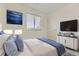 Bright bedroom with window, wall art and furniture; natural light at 4689 Tanner Peak Trl, Brighton, CO 80601